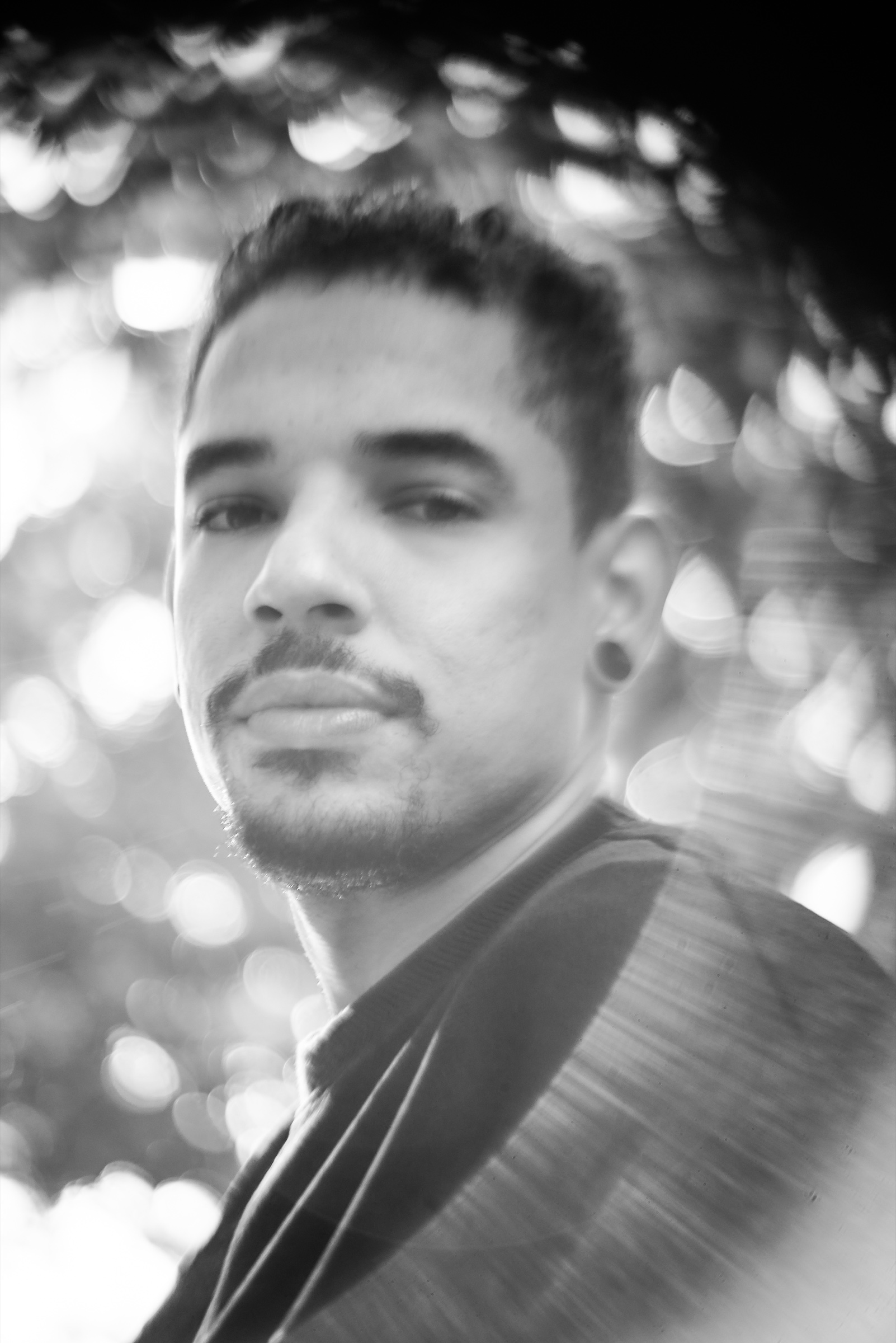 Maxim in a softly lit black-and-white portrait